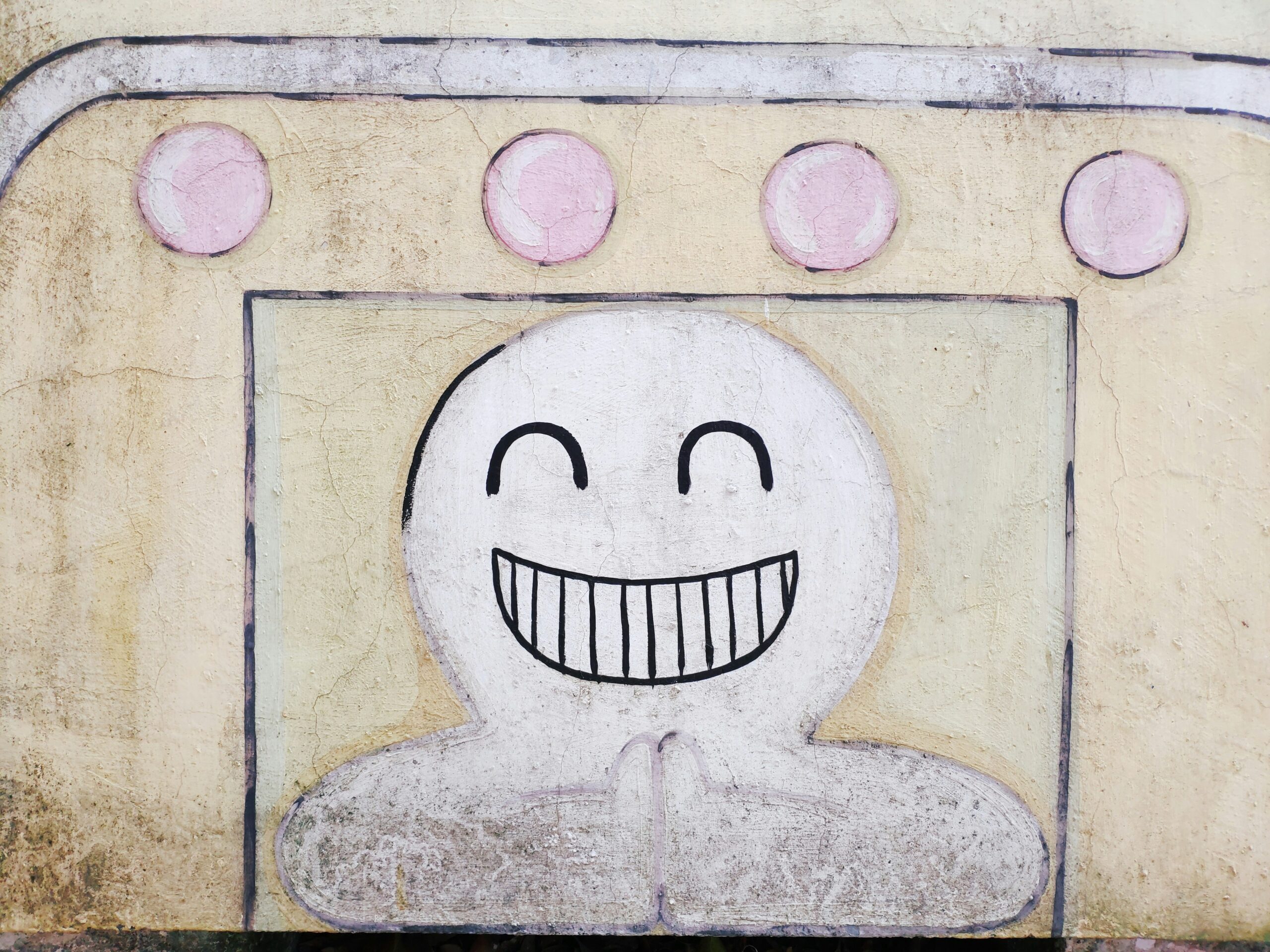 A cartoon image of a Tamagotchi character