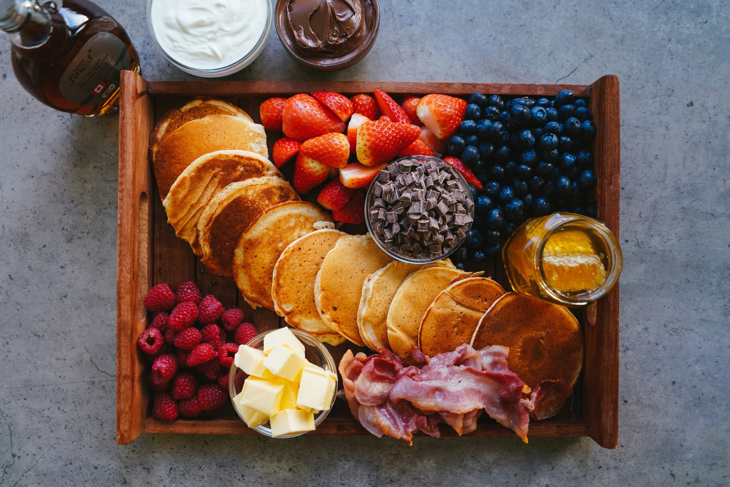 A table filled with healthy snack options like nuts, yogurt, and fruits