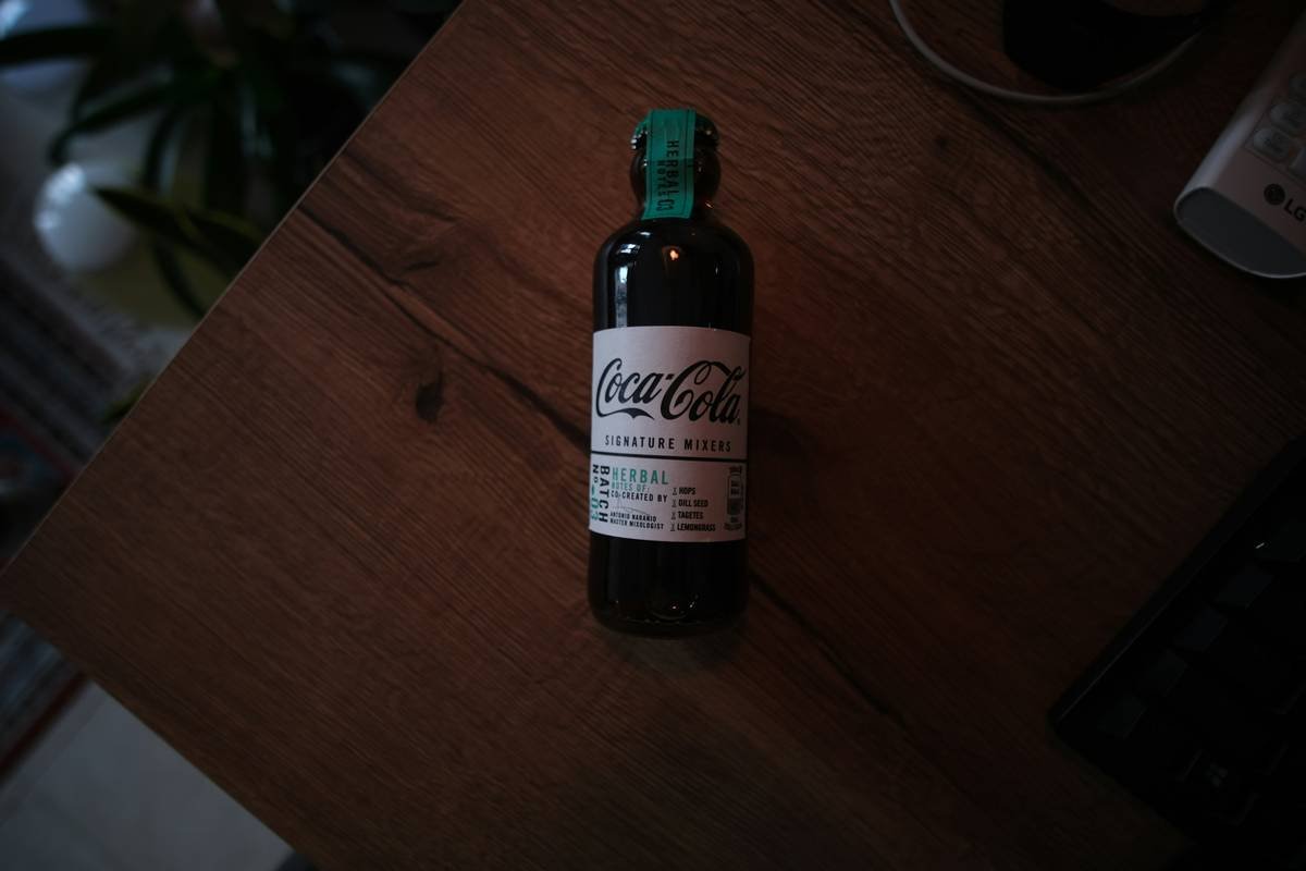 Photo of a person holding Gymnema Sylvestre leaves with text overlay reading 'Real People, Real Results'