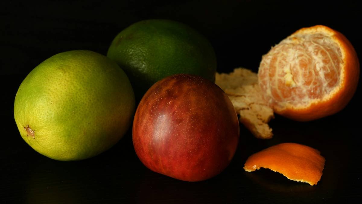 Person meditating while enjoying a bowl of fruit