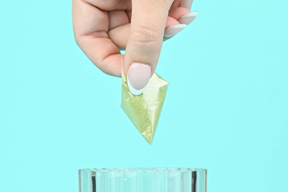Dipping a Blate Pape supplement pouch filled with herbal medicine powder - Photo courtesy of https://blated.com - credit appreciated