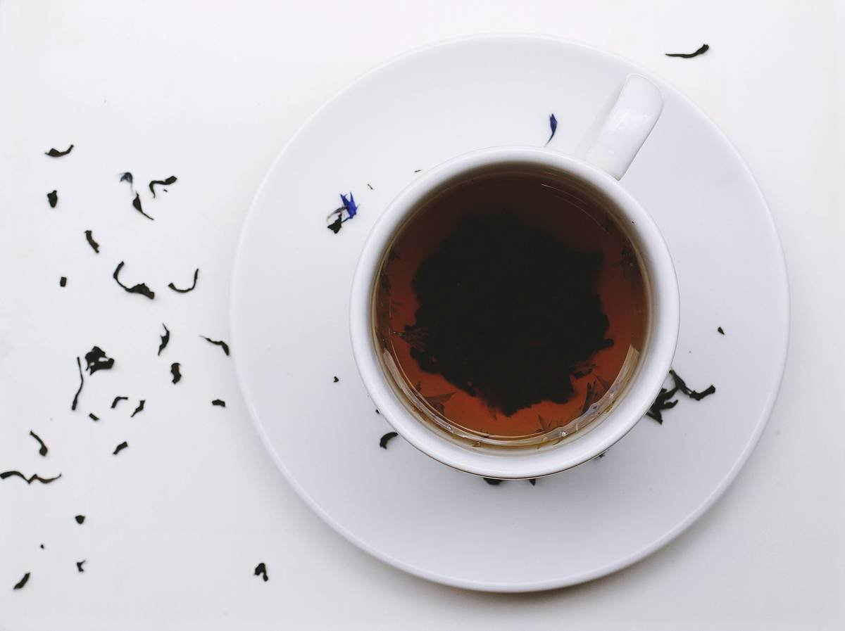 what does gymnema tea taste like - person tasting tea with surprised expression